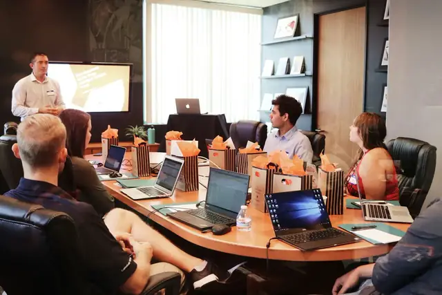People in a boardroom working session.